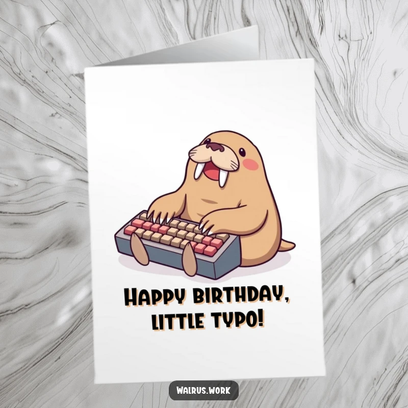 Funny Free Printable Birthday Card: Walrus joyfully typing on a tiny keyboard, a humorous downloadable gift.