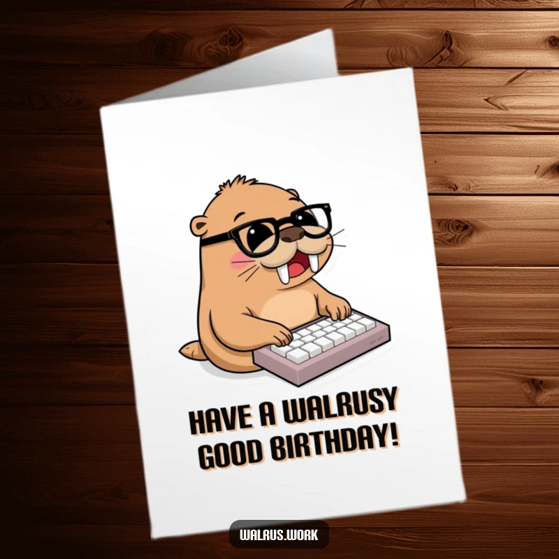 Funny Free Printable Birthday Card of a walrus wearing glasses joyfully typing on a miniature keyboard with flippers.